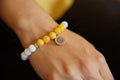 Bracelet Solstice — calcite jaune, howlite et charm soleil